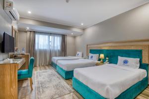 Postel nebo postele na pokoji v ubytování Mamlouk Pyramids Hotel