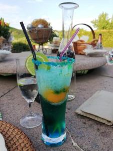 a drink in a glass sitting on a table at Wohnen direkt am Moselstrand in Bernkastel-Kues
