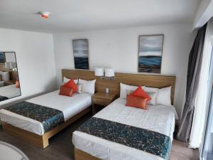 Postel nebo postele na pokoji v ubytování Hotel 39 Jamaica