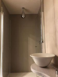 a bathroom with a glass shower with a bowl sink at Wohnen direkt am Moselstrand in Bernkastel-Kues +63 photos