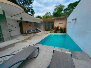 a swimming pool in the backyard of a house at VILLA DEL PEZ in Sayulita