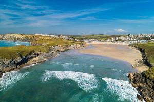 an aerial view of a beach with the ocean at Newquay Bay Resort Sandy Toes - Hosting up to 6 in Newquay