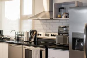 a kitchen with a stove top oven in a kitchen at Anida Silk 401 in Guatemala +1 photo