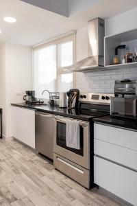 a kitchen with a stove and a counter top at Anida Silk 401 in Guatemala
