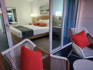 Ein Bett oder Betten in einem Zimmer der Unterkunft Hotel 39 Jamaica