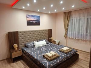 Postel nebo postele na pokoji v ubytování VASKE APARTMAN