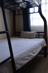 a bedroom with two bunk beds with a pillow at ELDORET STAYS in Eldoret