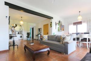 a living room with a couch and a table at Let´s go to Valhalla in Chiclana de la Frontera