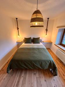 Postel nebo postele na pokoji v ubytování Gîte urbain L'Oneux