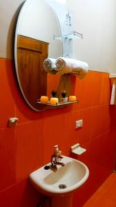 a bathroom with a sink and a mirror at HGA-Coral-Spa in La Paz