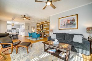 a living room with a couch and a table at Lakeside Cashiers Cabin with Private Boat Dock! in Cullowhee