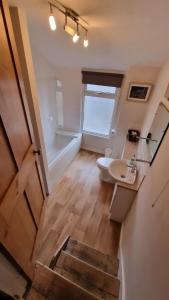 a bathroom with a toilet and a sink at Stamford - 2 bed terrace house in Lincolnshire