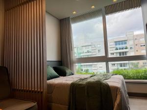Tempat tidur dalam kamar di - Livin Resort House -