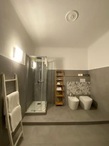 a bathroom with a shower and a toilet and a sink at AffittaCamere Columbus in Camogli