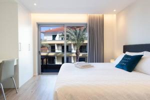 Krevet ili kreveti u jedinici u okviru objekta Luxury and modern apartment in Porto Moniz center