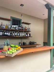 a shelf with fruits and vegetables on a wall at Sazagua Cocora Reserva Natural in Salento