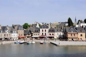 a town with boats in the water and buildings at grand studio avec parking à 10 minutes des plages in Lorient