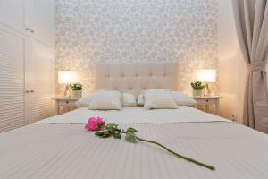 Posteľ alebo postele v izbe v ubytovaní Apartments & Rooms Perla
