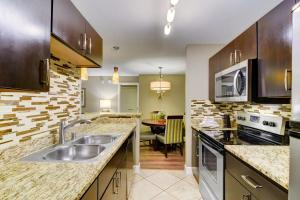 a kitchen with a sink and a counter top at Holiday Inn Club Vacations at Desert Club Resorts in Las Vegas