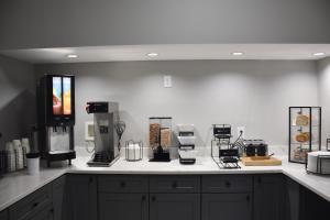 a kitchen with a counter top with appliances on it at SureStay by Best Western Huntsville University Area in Huntsville
