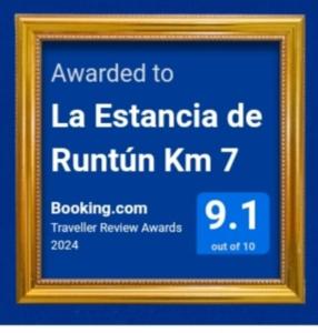 zdjęcie znaku w złotej ramce w obiekcie La Estancia de Runtún Km 7 w Baños