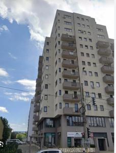 a tall building with balconies on the side of it at DARI Studio in Cluj-Napoca
