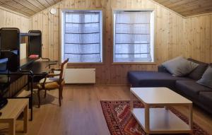 Posezení v ubytování Flott Feriehus - Tjørhom