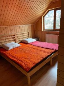 a bedroom with a large bed in a cabin at Kvasy 838 in Kvasy
