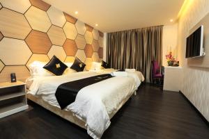 Postel nebo postele na pokoji v ubytování Mercury Boutique Hotel