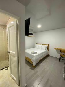 Cama o camas de una habitación en Hotel Alameda Plaza