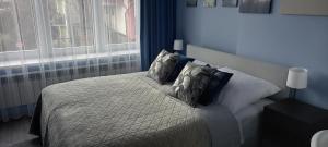 Ліжко або ліжка в номері Apartament Grunwaldzka