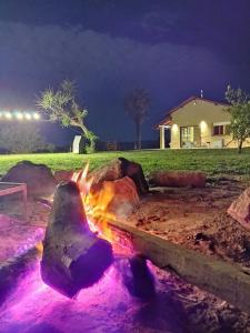 a fire pit in a yard at night at Casa Laguna de los Padres in Mar del Plata