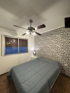 מיטה או מיטות בחדר ב-Departamentos Microcentro de Salta Dean Funes