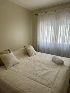 מיטה או מיטות בחדר ב-Departamentos Microcentro de Salta Dean Funes