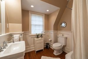 a bathroom with a sink toilet and a window at LUX Entire home in Bethesda RARE in Bethesda