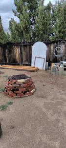 a pile of bricks in a yard next to a fence at Private Guest Cozy Room w/Full Bathroom in Lake Isabella