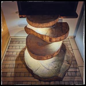 a set of wooden stairs on a tile floor at Cinderella Guitars 