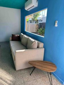 a living room with a couch and a table at 6 bedsroom 3 baths beach shopping Carolina Puerto Rico by Rentalspr in Carolina