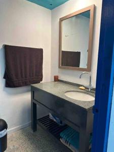 a bathroom with a sink and a mirror at 6 bedsroom 3 baths beach shopping Carolina Puerto Rico by Rentalspr in Carolina