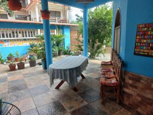 a table and a chair on a patio at La casa del sueño in Mazunte
