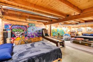 a bedroom with a mural on the wall at Riverfront A-Frame Cabin in Troy with Pool and Dock! in Troy