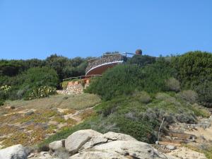 a bridge on top of a hill with rocks at Villa Capo Boi in Villasimius