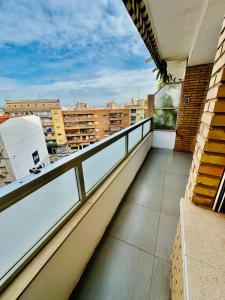 a balcony with a view of a city at Apartamento Turístico Pizarro in Mérida