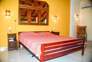 Posteľ alebo postele v izbe v ubytovaní King Coconut Lodge