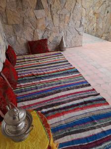 a room with a large rug on the floor at RISA FAMILY in Taroudant