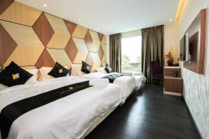 Postel nebo postele na pokoji v ubytování Mercury Boutique Hotel