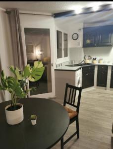 a kitchen with a table and a dining room at Cergy vers Paris 4-6 personnes in Cergy