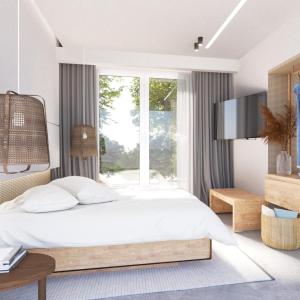 a bedroom with a large bed and a large window at Dionisos Resort in Pefkochori