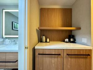 a kitchen with a counter top and a sink at Modesto Hotel - Suite A in Modesto
