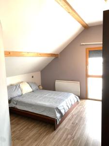 Posteľ alebo postele v izbe v ubytovaní Maison chaleureuse au cœur du massif Jurassien